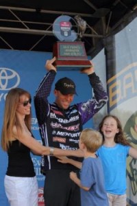 Aaron Martens of Leeds, Ala., wins the Toyota Angler of the Year race, a coveted honor in bass fishing. His wife, Lesley, and children Spencer (left) and Jordan (right) joined him in celebrating his second AOY title. Photo by Seigo Saito/Bassmaster