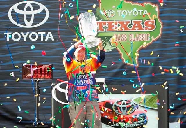 Keith Combs Hoists his 2013 TTBC Trophy as the Toyota Texas Bass Classic Champion at Lake Conroe October 6, 2013. (Photo by Jason Miczek)