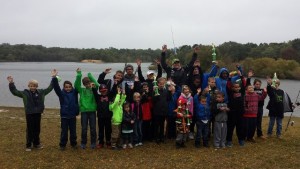 2015 Youth Fishing Tournament participants pose  with the tournament host